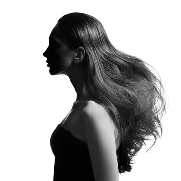 A sports fan happily using a mobile app.